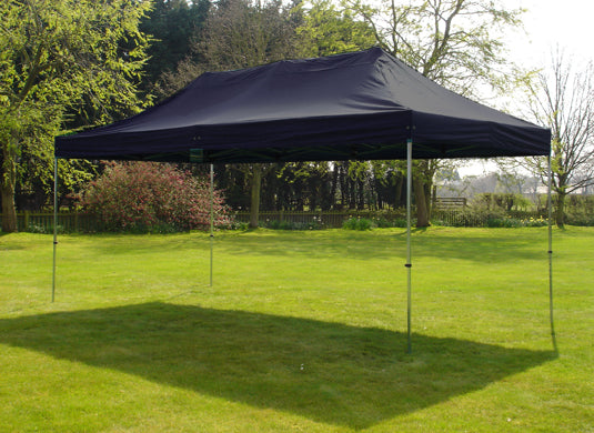 3m x 4.5m Trader-Max 30 Easy Up Gazebo Navy Blue Image 3 In Use In Garden